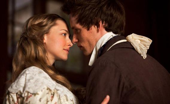 Amanda Seyfried as Cosette and Eddie Redmayne as Marius in Les Misérables.