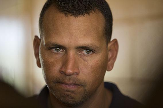 New York Yankees' Alex Rodriguez talks with reporters outside the Lakeland Flying Tigers visitor's clubhouse after reporting for his rehab assignment with the Tampa Yankees in Lakeland, Florida July 5, 2013.