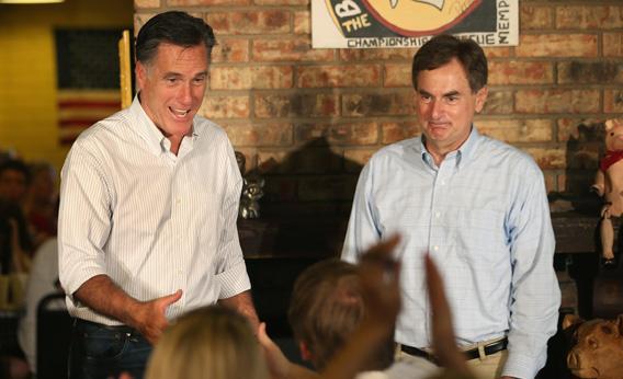Mitt Romney, left, and Senate candidate Richard Mourdock, right, greet supporters at a campaign event.