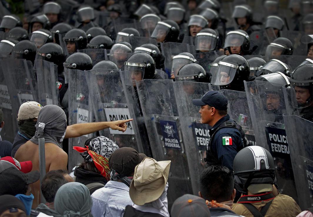 parents of the 43 missing young men as they marched toward the city's airport,