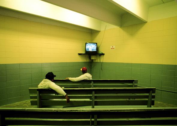 Two men watch television in the Angola State Penitentiary, where a majority of inmates are "lifers" (Prisoners for the rest of their life) on April 01, 2002 in Angola, Louisiana. 