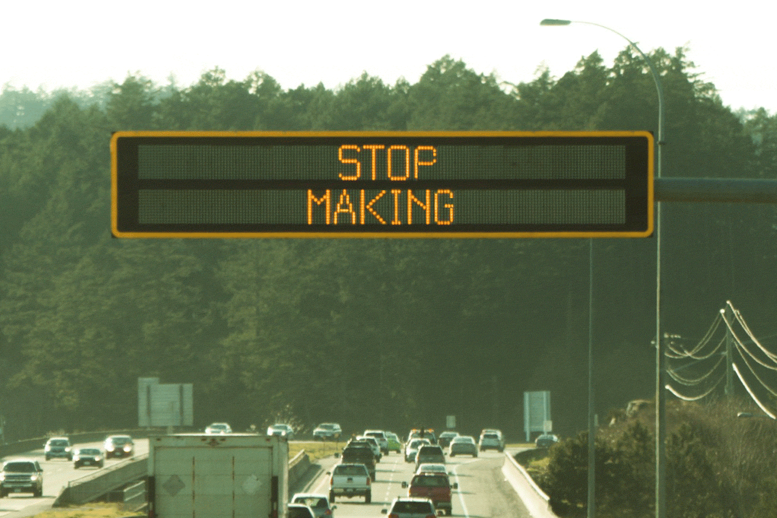 A flashing sign that reads: stop making signs with bad jokes. 