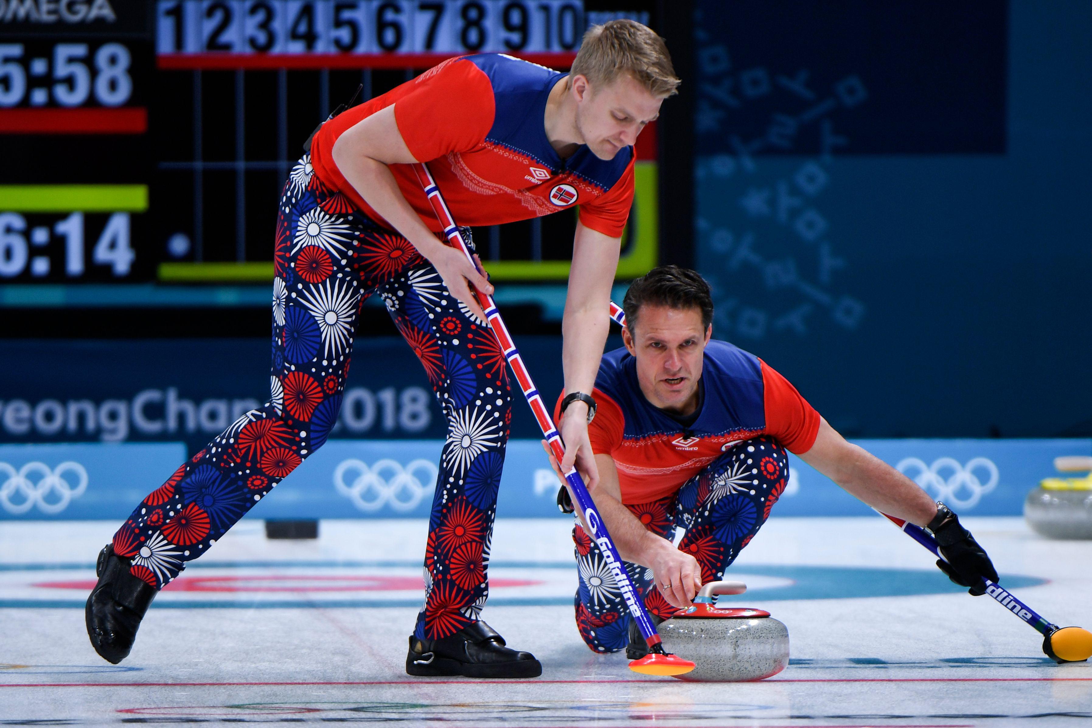 Norway's Thomas Ulsrud pushes the stone during the curling men's round robin session between Norway and Denmark during the Pyeongchang 2018 Winter Olympic Games at the Gangneung Curling Centre in Gangneung on February 18, 2018. / AFP PHOTO / WANG Zhao        (Photo credit should read WANG ZHAO/AFP/Getty Images)