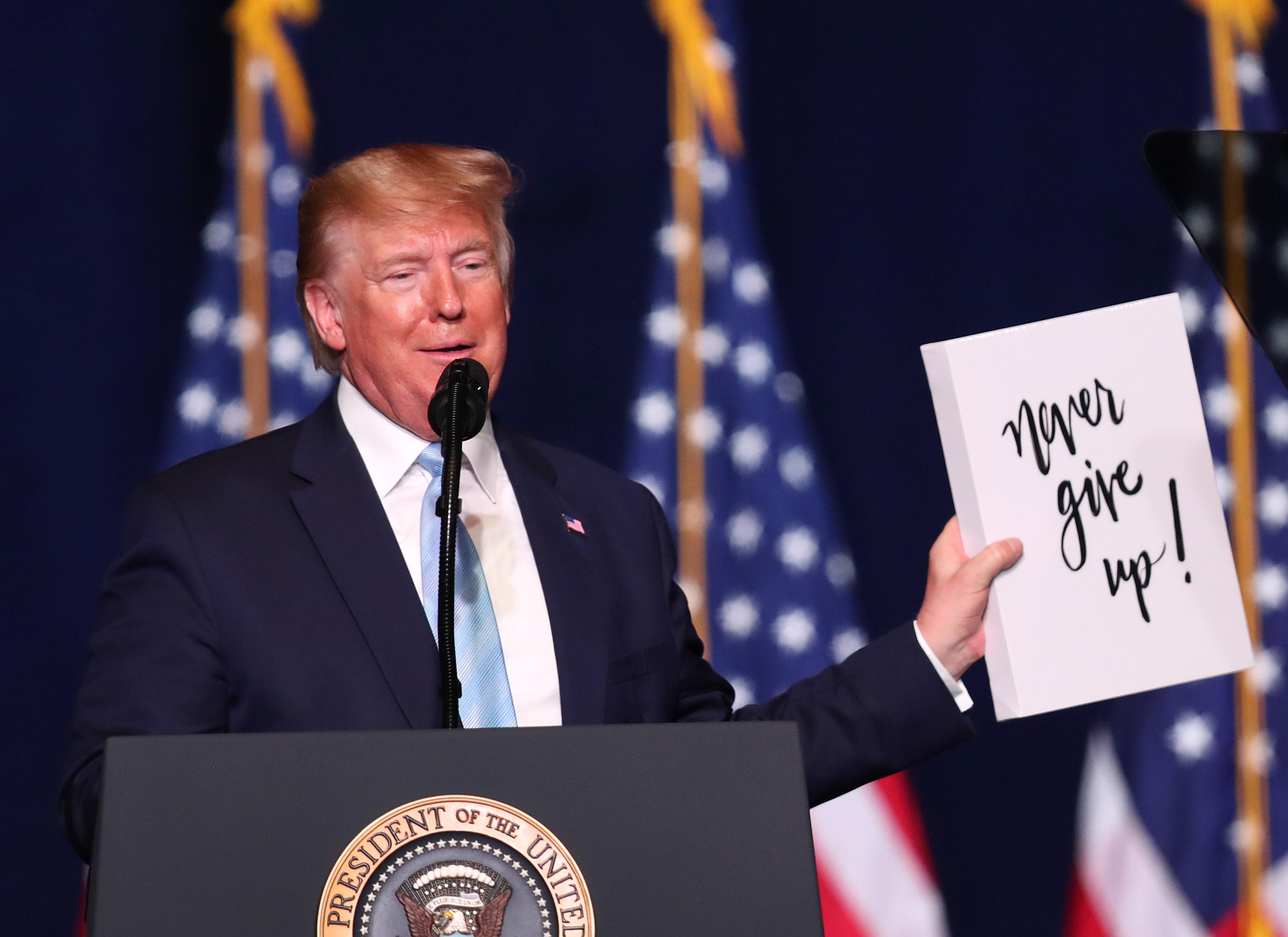 Best Photo Of The Week: Donald Trump “Never Give Up!” Sign.