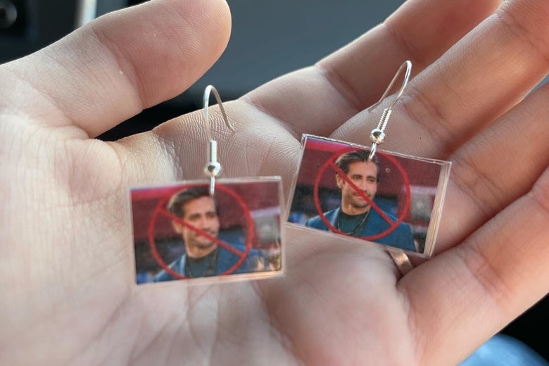 Earrings feature Jake Gyllenhaal's face crossed out. 