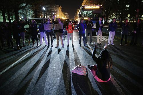 Demonstrators block traffic at 15th Street and Pennsylvania Avenue, NW, during a protest against a New York grand jury decision December 3, 2014 in Washington, DC. 