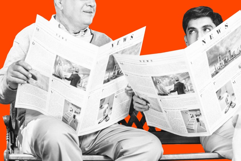 An older adult and a young adult both read the newspaper.