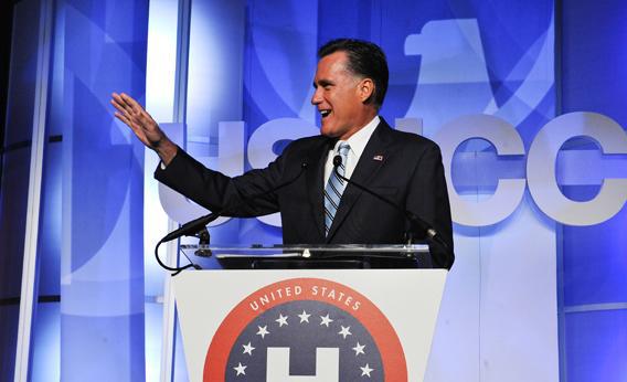 Mitt Romney waves to one of his sons and grandsons before addressing the US Hispanic Chamber of Commerce.