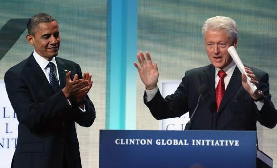 President Obama applauds as Bill Clinton speaks at the Clinton Global Initiative meeting in September. 