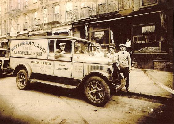 The Harlem Macaroni Co.'s delivery truck around 1934. Company owner Giorgio Cataudella is seen third from left.