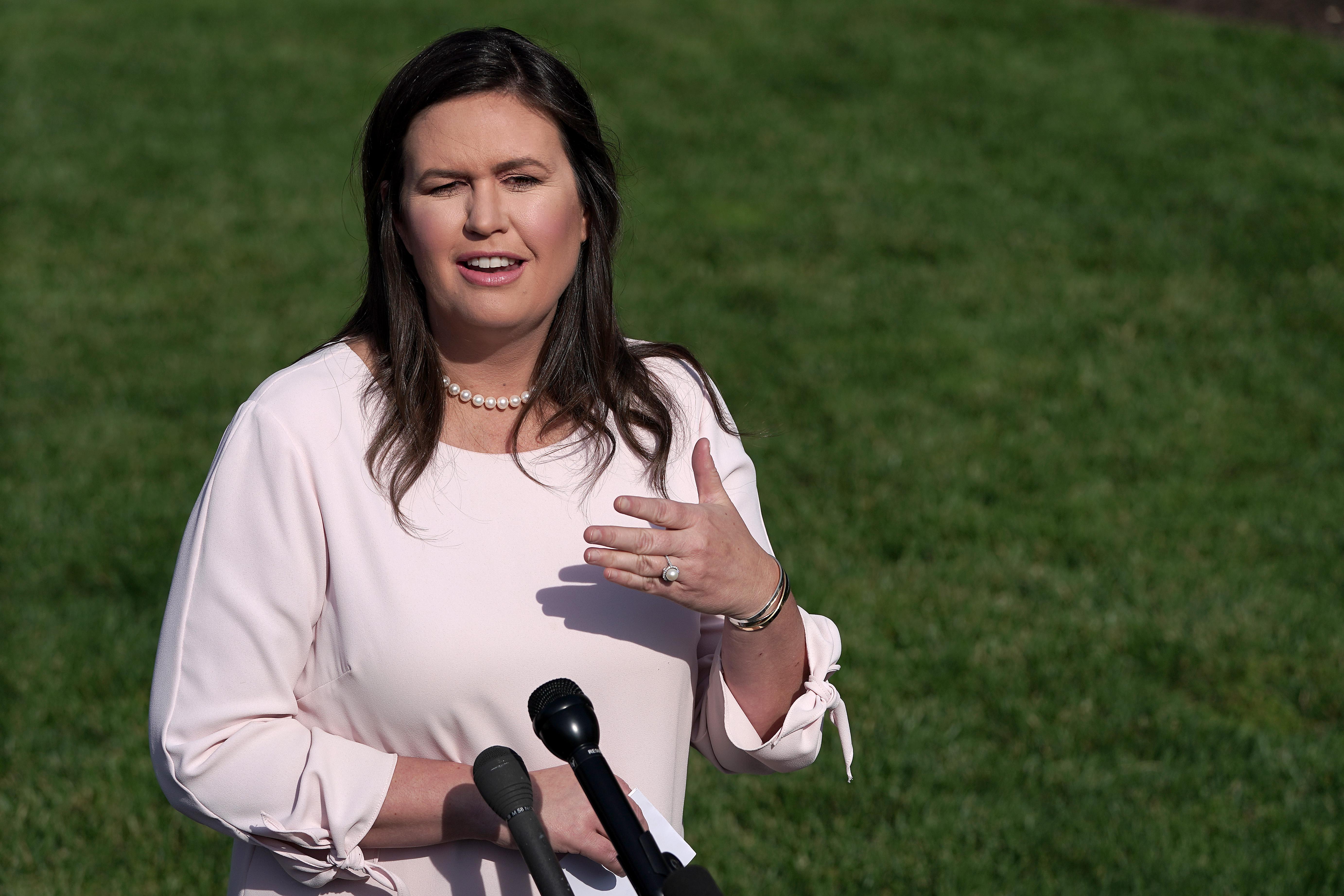 White House press secretary Sarah Huckabee Sanders talks to reporters outside the West Wing May 23, 2019 in Washington, D.C.