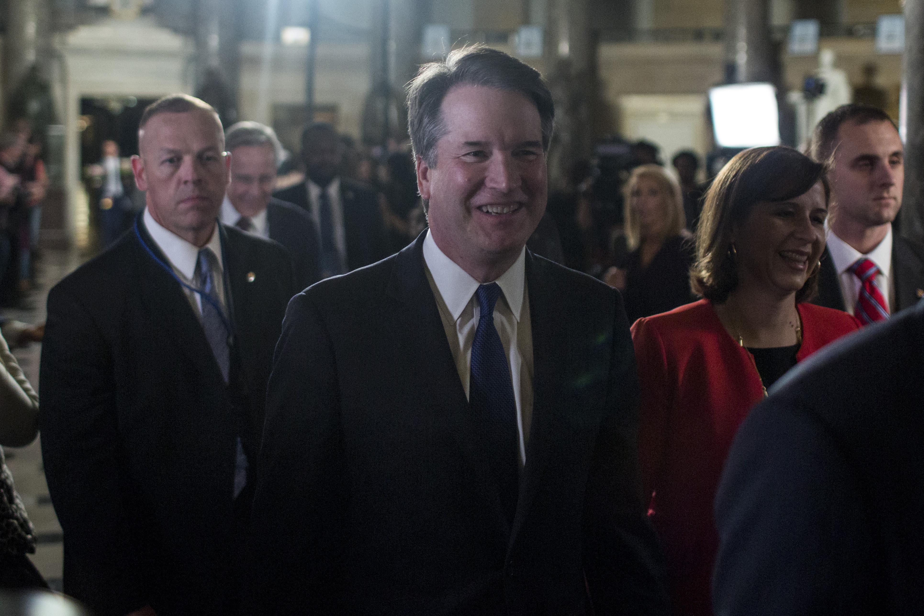 Kavanaugh smiling as he and others file into the House chamber.