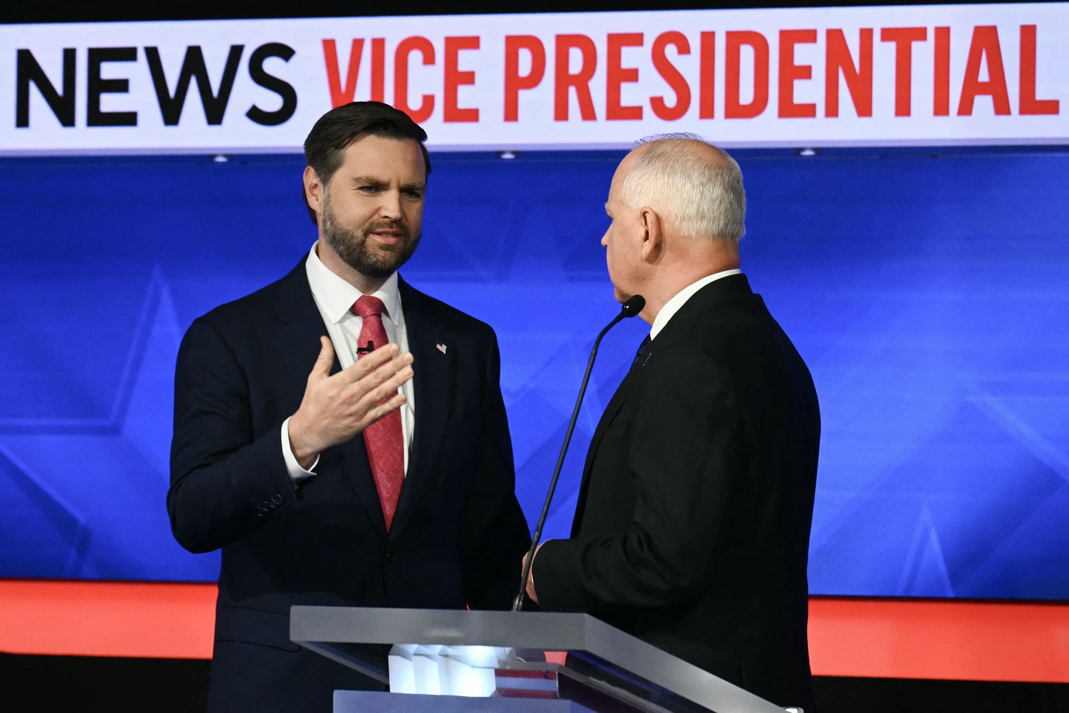 J.D. Vance and Tim Walz onstage.