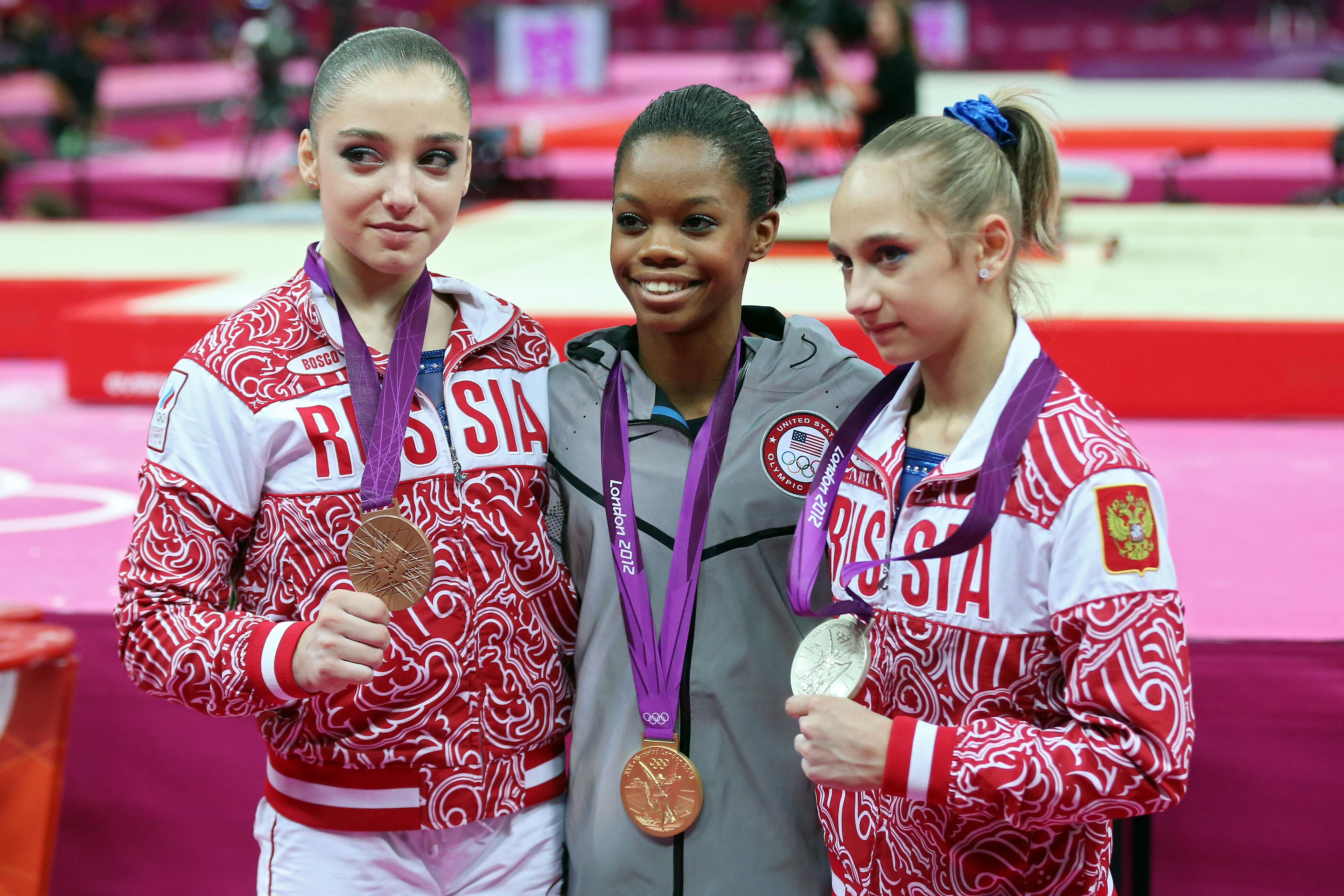 Aliya Mustafina, Gabby Douglas, and Viktoria Komova 