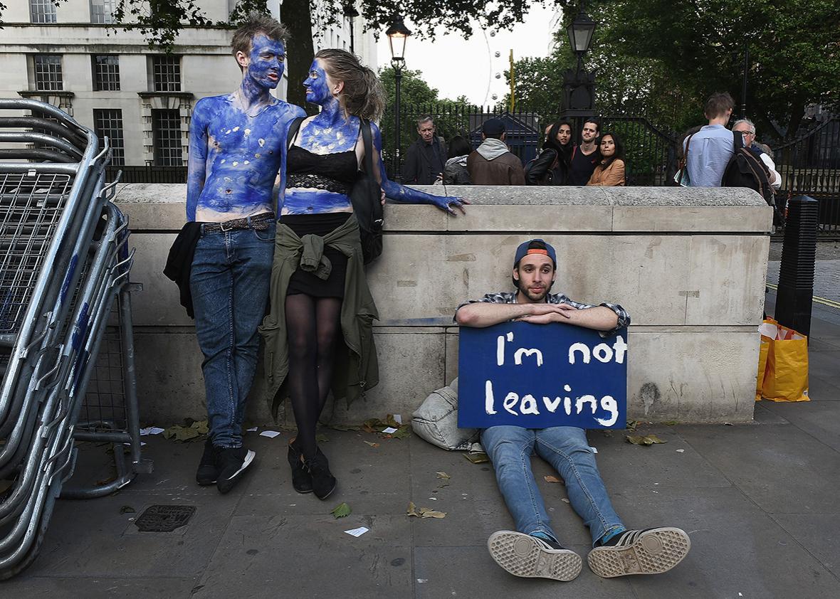 A young couple painted as EU flags protest on outside Downing Street against the United Kingdom's decision to leave the EU following the referendum on June 24, 2016 in London, United Kingdom. 