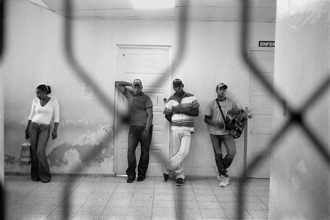 Maternity patients' relatives wait outside the maternity ward at the Juan Pablo Pina public hospital in San Cristóbal, Dominican Republic. Female relatives are allowed to enter the ward after delivery, when they care for their family members, but men are not allowed to enter.