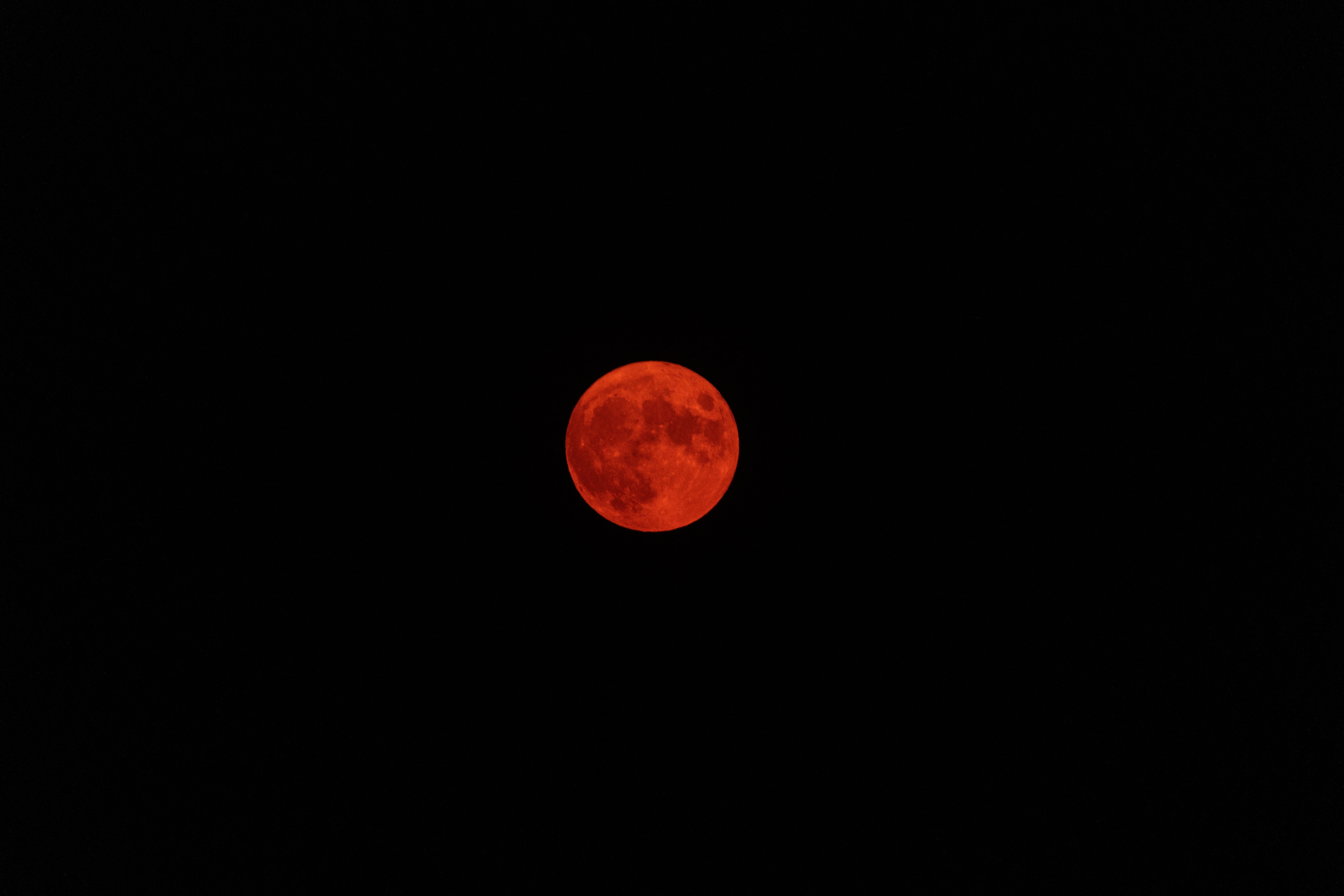 The moon glows burnt orange behind thick wildfire smoke on July 23, 2021 in Blush, Oregon. 