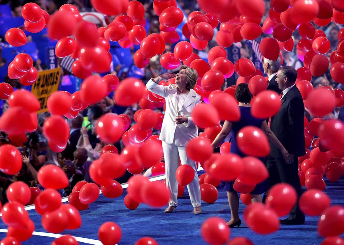 Democratic presidential candidate Hillary Clinton watches balloons drop at the end of the fourth day of the Democratic National Convention at the Wells Fargo Center, July 28, 2016 in Philadelphia, Pennsylvania. 