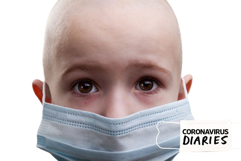 A baldheaded child wearing a mask