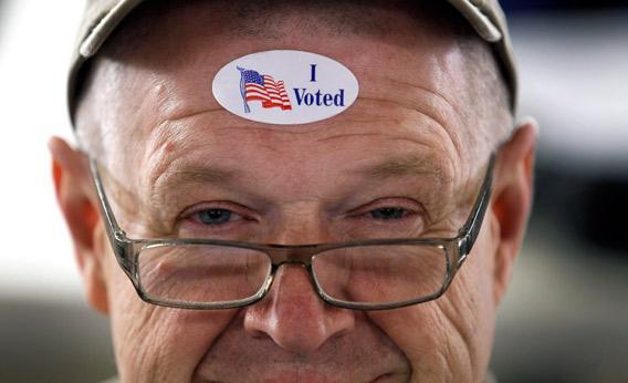John Vandermark wears his ' I Voted' sticker after voting.