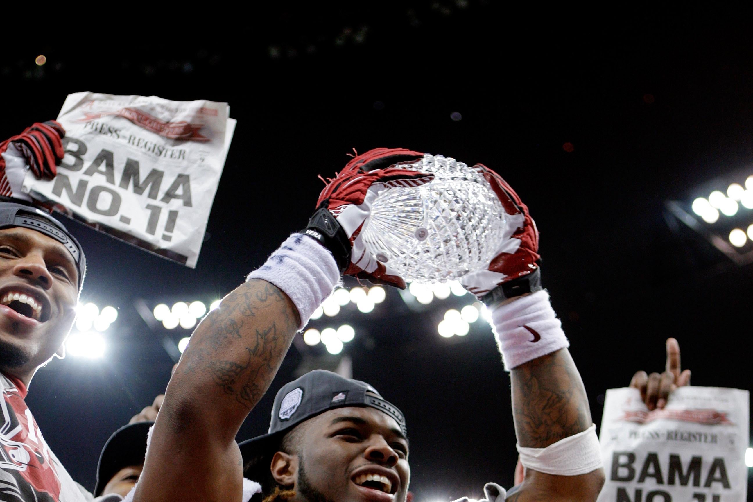 NEW ORLEANS, LA - JANUARY 09:  Trent Richardson #3 of the Alabama Crimson Tide celebrates with the trophy after defeating Louisiana State University Tigers in the 2012 Allstate BCS National Championship Game at Mercedes-Benz Superdome on January 9, 2012 in New Orleans, Louisiana. Alabama  won the game by a score of 21-0.  (Photo by Andy Lyons/Getty Images)