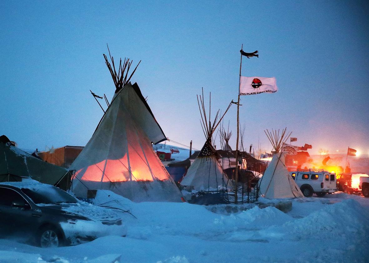 Activists at Oceti Sakowin near the Standing Rock Sioux Reservation brace for sub-zero temperatures expected overnight on December 6, 2016 outside Cannon Ball, North Dakota. 