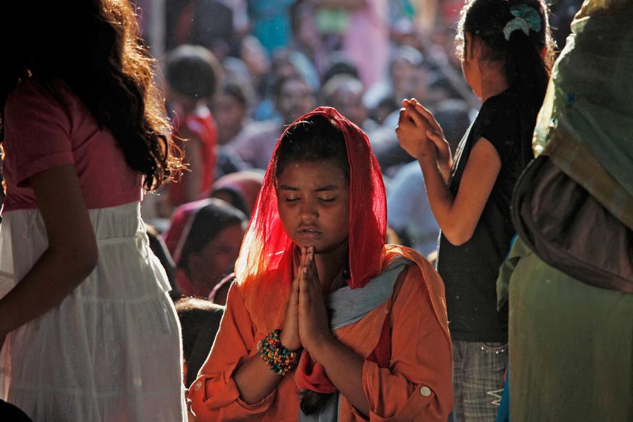 A Pakistani Christian woman prays during a Good Friday service at the Saint Anthony Church in Lahore March 29, 2013.