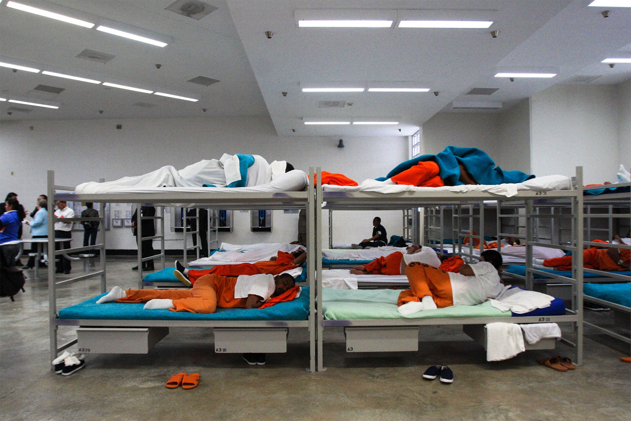 Male detainees sleep on their bunks in the dormitory of the Alpha Unit at Port Isabel detention facility in Texas, United States on December 17, 2008.