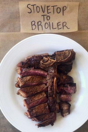 A T-bone steak on a plate next to a sign labelled "Stovetop to Broiler."