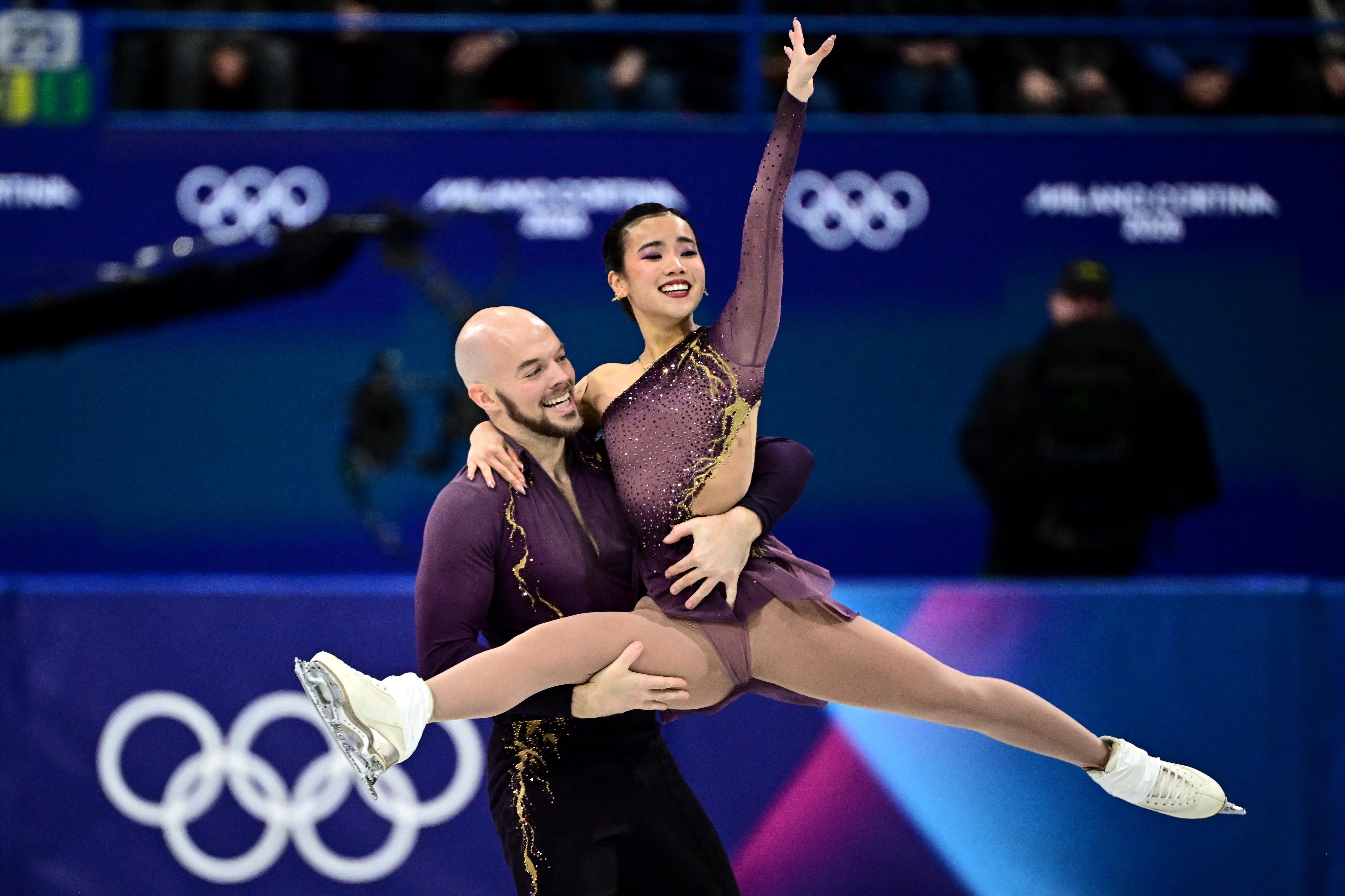 USA's Ellie Kam and USA's Danny O'Shea compete in the figure skating pair skating short program during the Milano Cortina 2026 Winter Olympic Games at Milano Ice Skating Arena in Milan on February 15, 2026. (Photo by JULIEN DE ROSA / AFP via Getty Images)