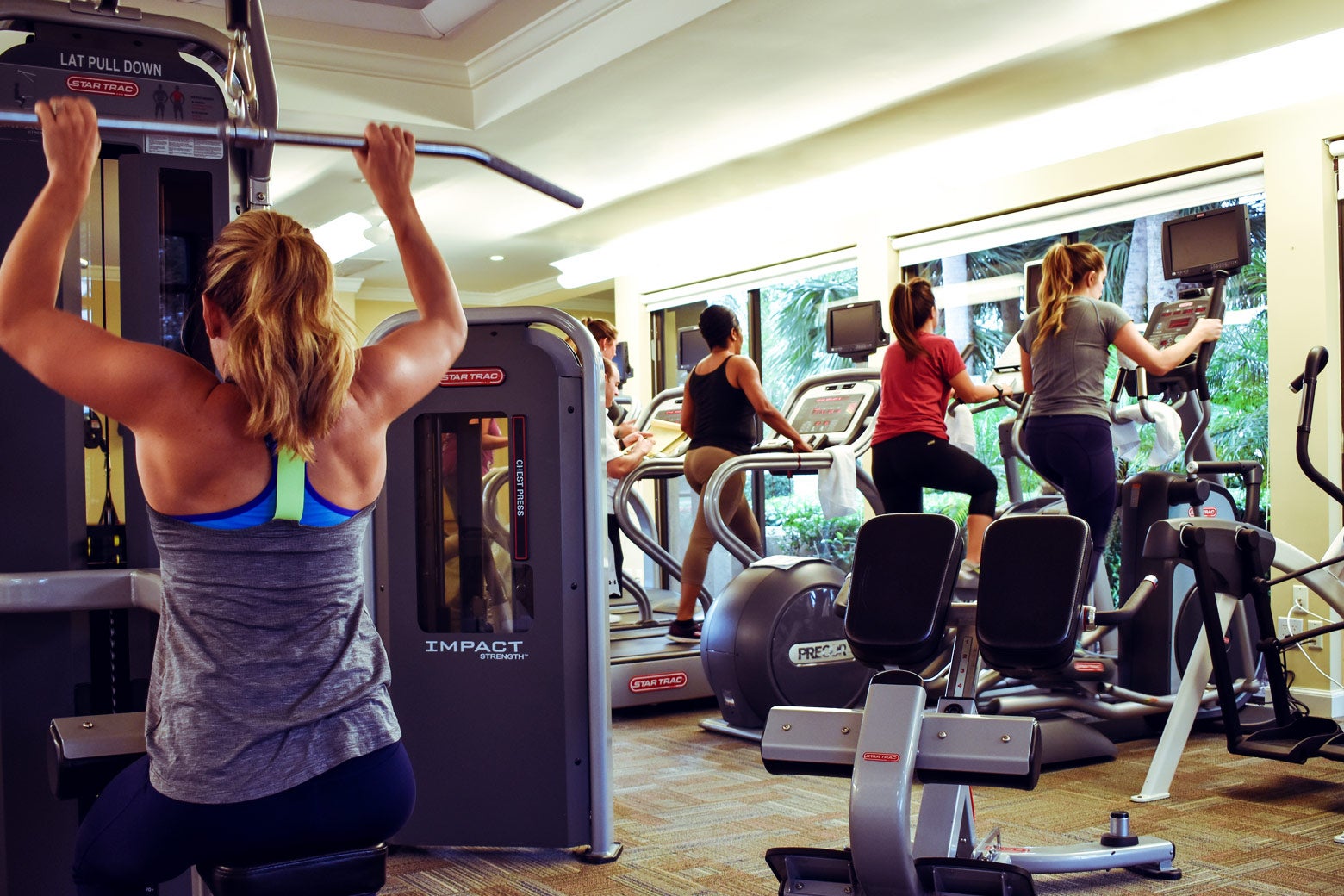 Employees of the Breakers work out in a fitness center.