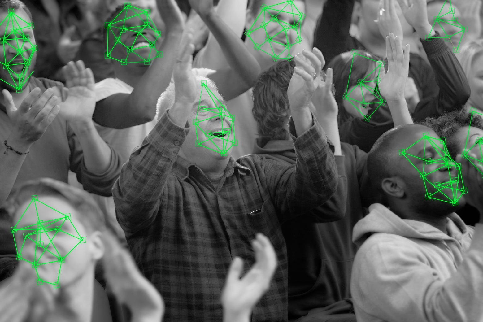 Fans cheer at a stadium, while green facial recognition tech scans their faces.