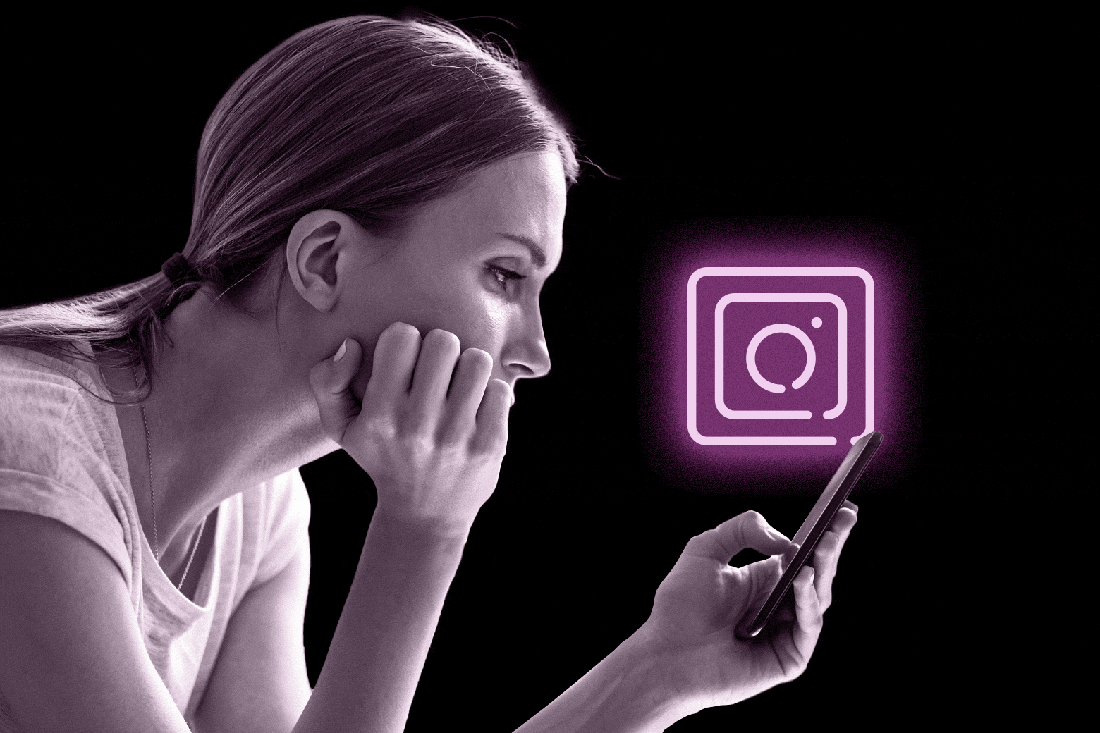 Woman looking at a phone with the Instagram logo.
