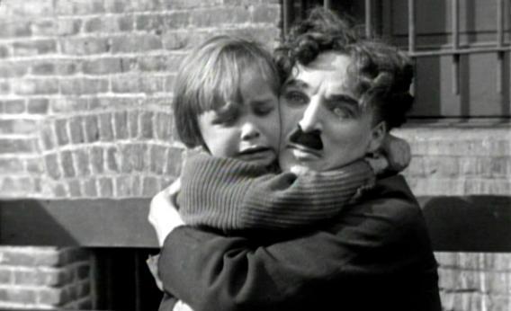Charlie Chaplin and Jackie Coogan in The Kid.