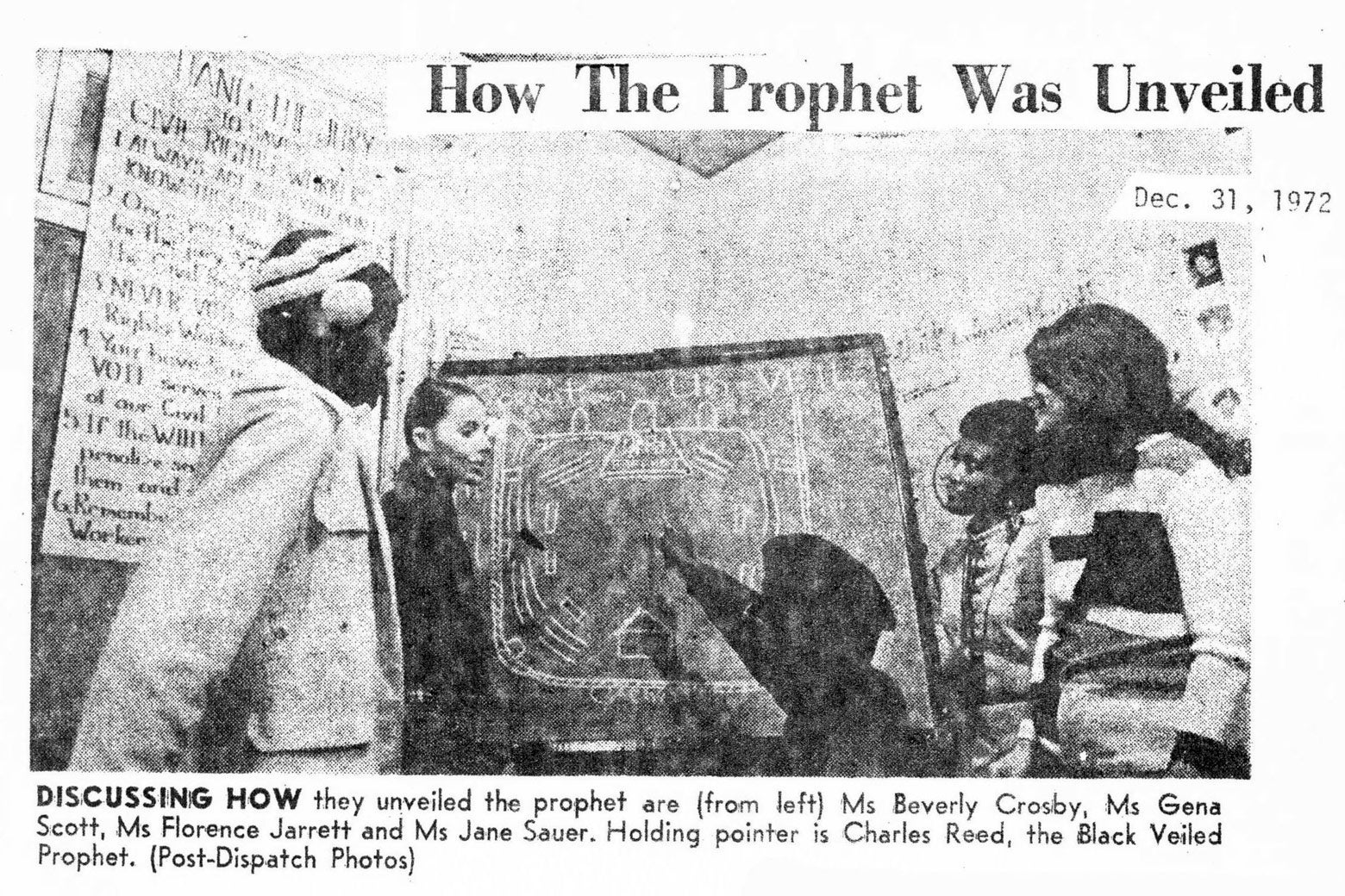 A clip from a pamphlet shows people crowded around a blackboard with schematics on it.