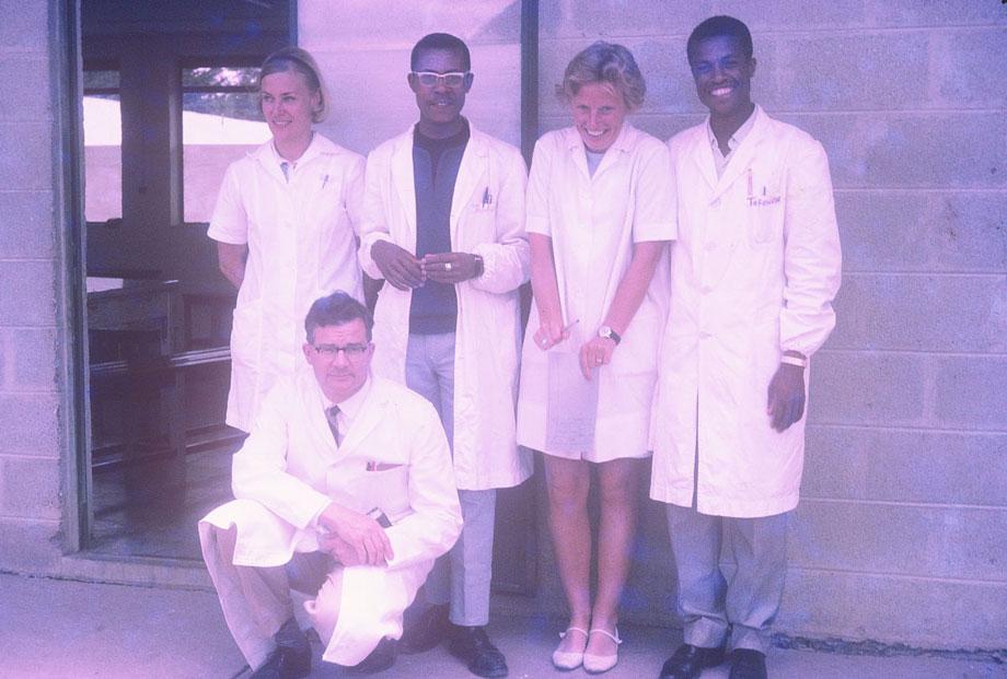 African-and-Western-doctors-posingA group of five doctors pose for the camera. These collaborations were highly regarded by the churches and aid organizations, and the African doctors had access to some of the best trained teachers and mentors in the world. In this shot, the real camaraderie between the doctors is on full display.