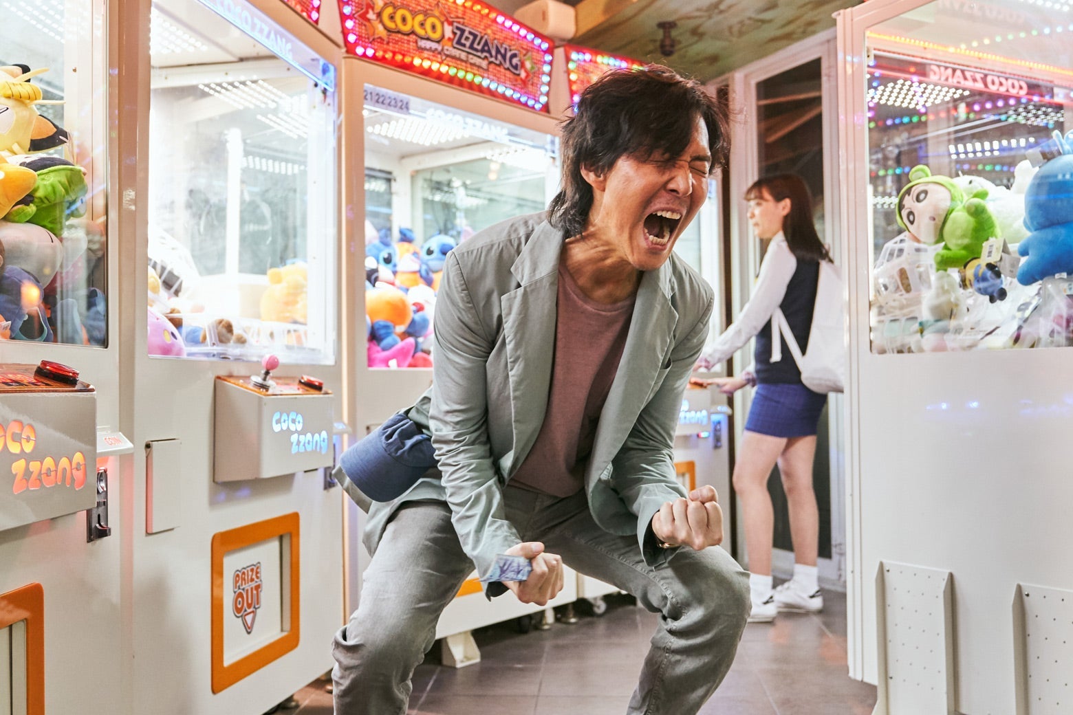 Man screaming after losing at a carnival game.