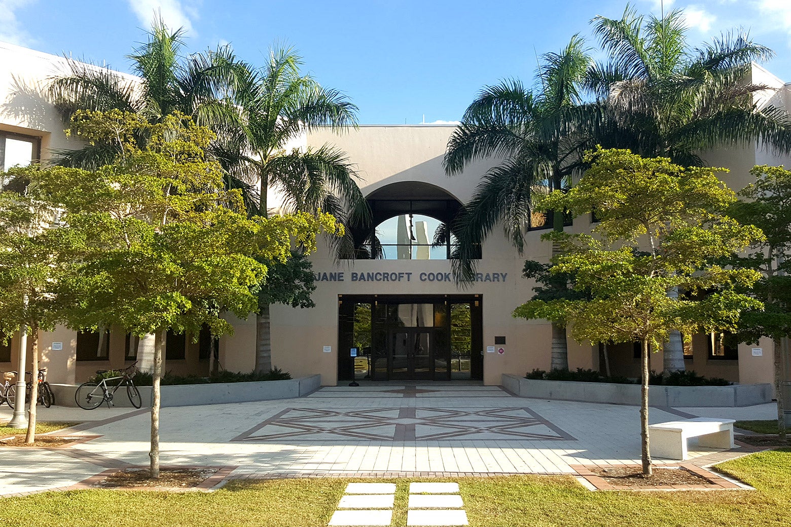 The Jane Bancroft Cook Library entrance at the New College of Florida is seen among palm trees. 
