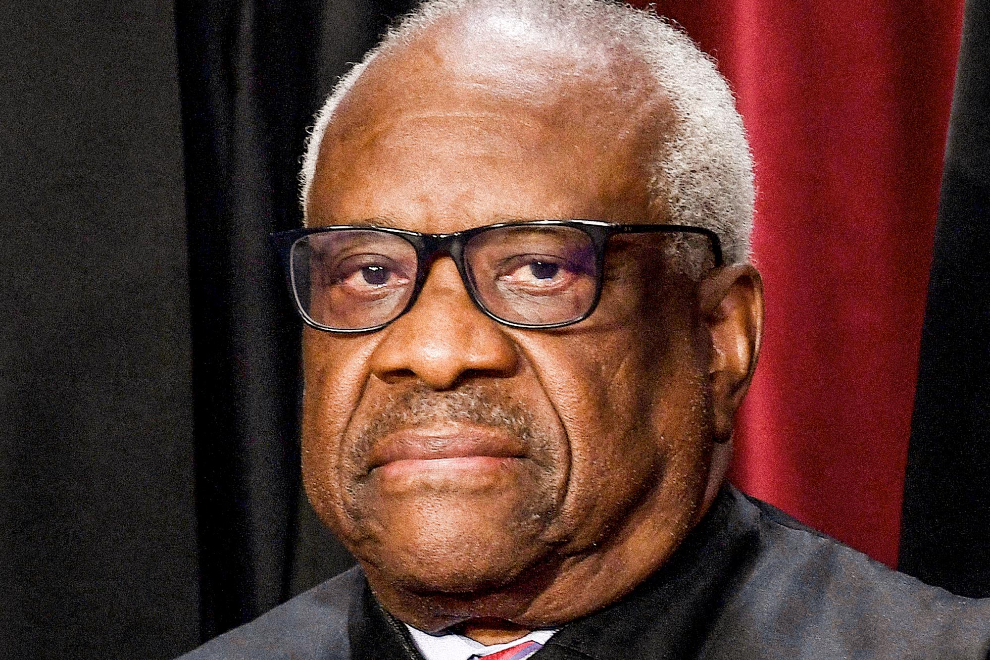 Associate Supreme Court Justice Clarence Thomas, in black robes.
