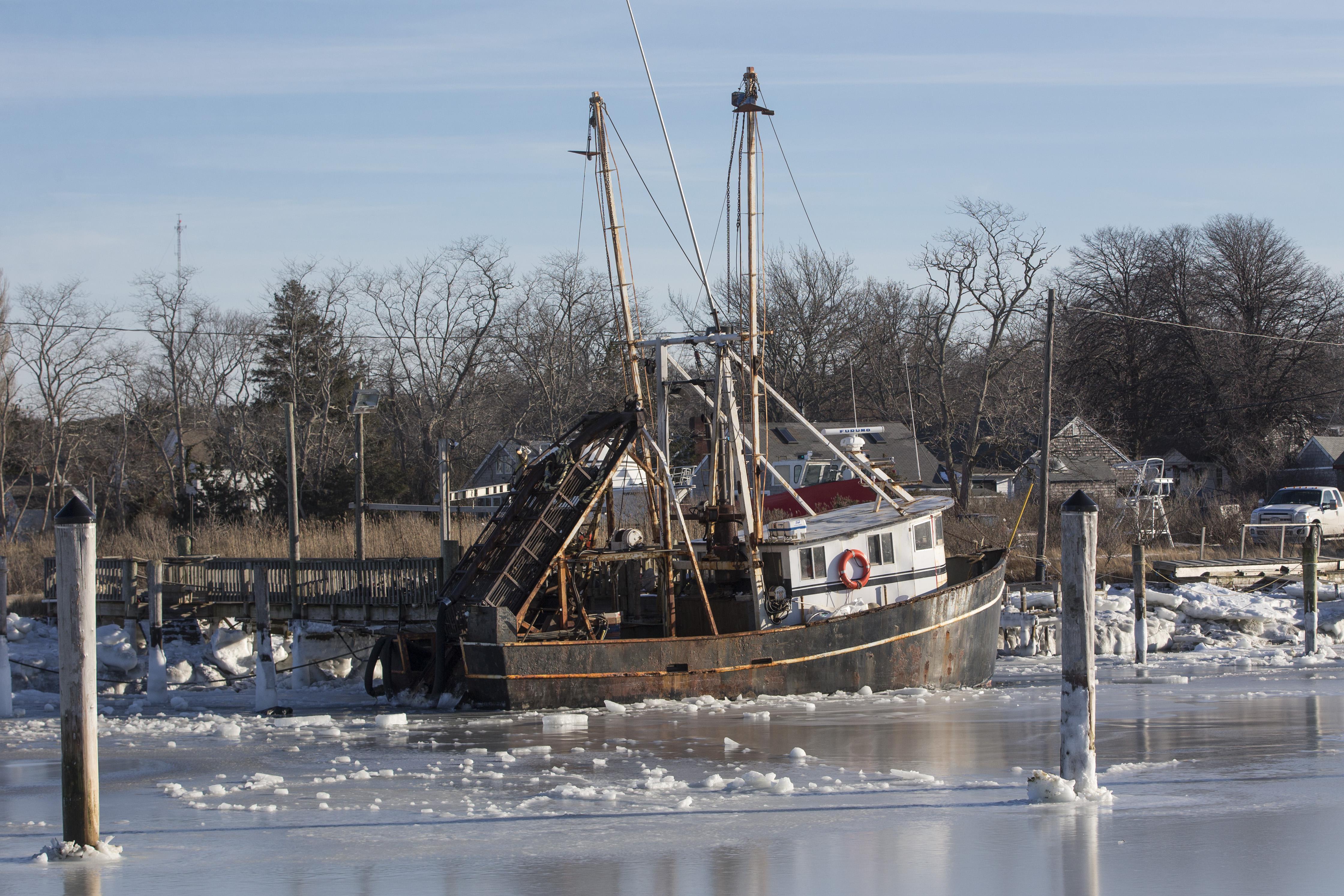 ORLEANS, MA - JANUARY 03:   Sea ice surrounds a boat in Rock Harbor on January 3, 2018 in Orleans, Massachusetts, A winter storm is hitting the east coast from Florida to New England bringing snow and frigid temperatures. (Photo by Scott Eisen/Getty Images)