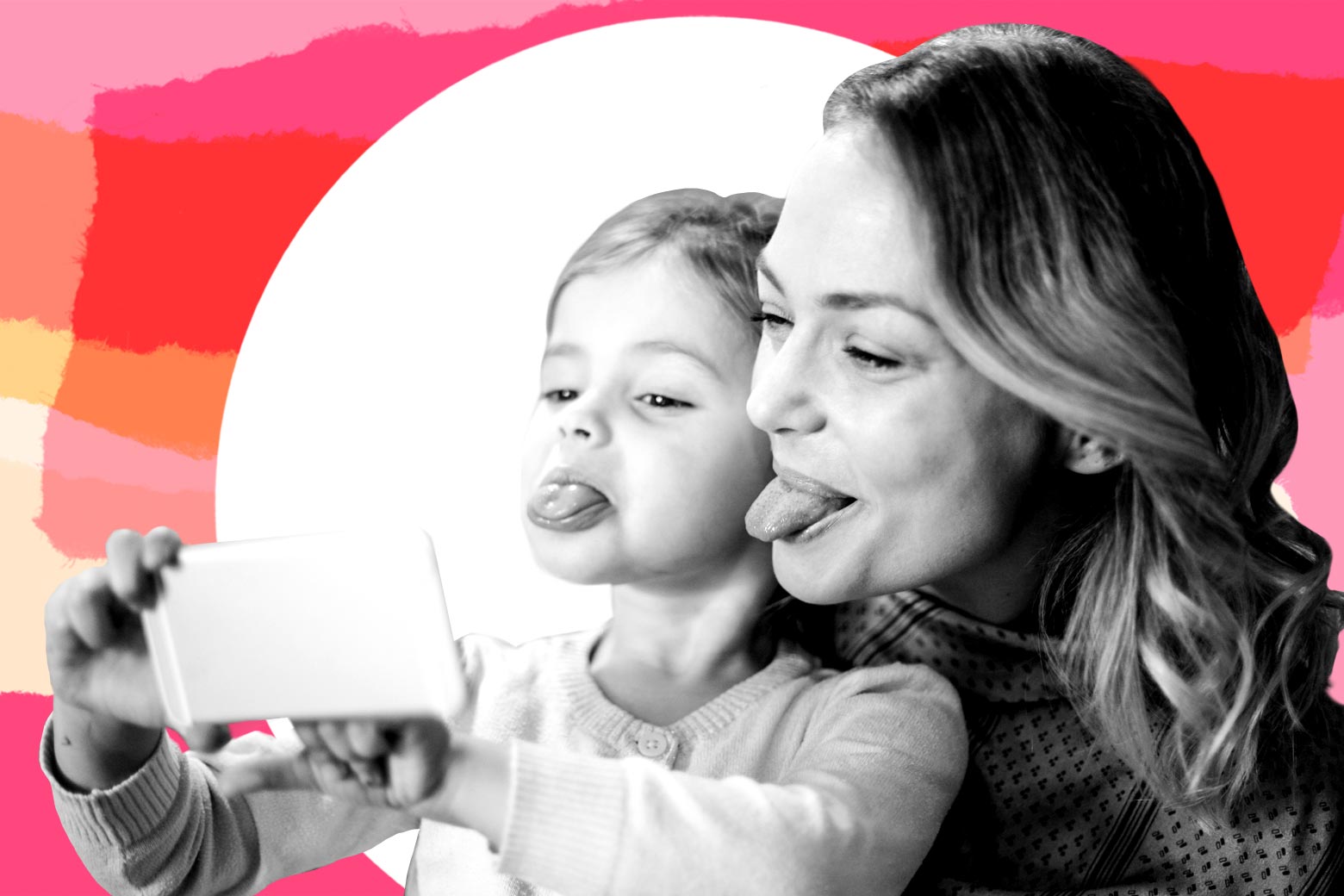 Mother and daughter taking a selfie together while sticking out their tongues