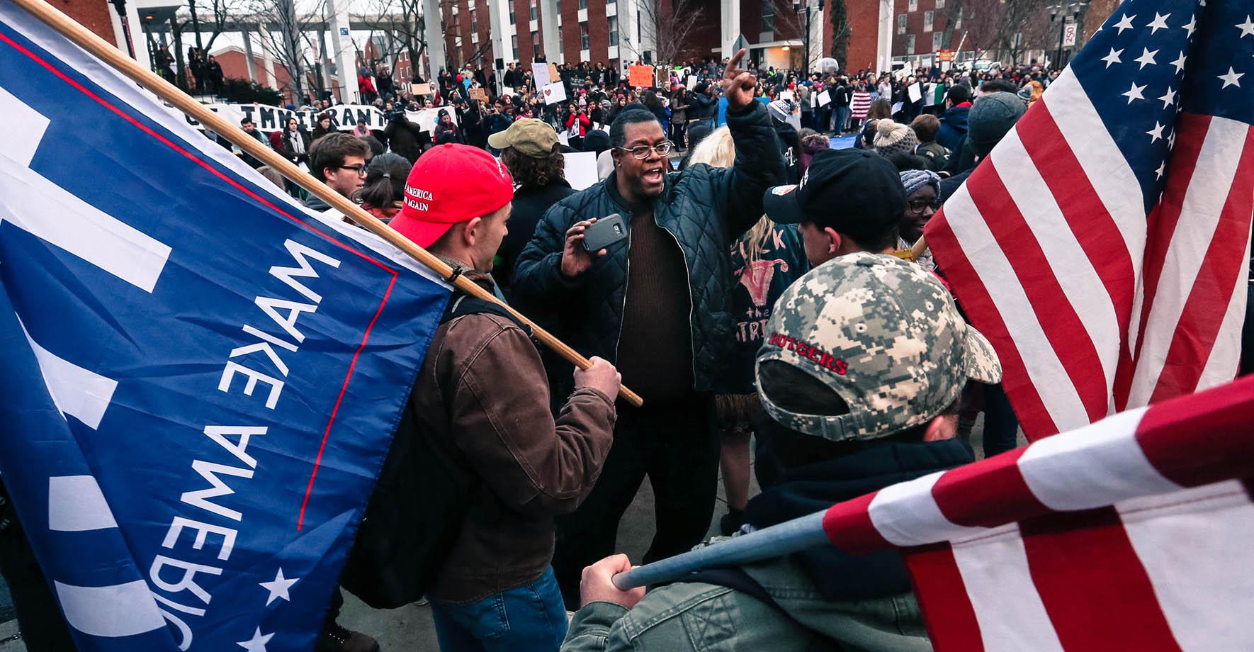 Daryle Lamont Jenkins argues with supporters of President Trump.