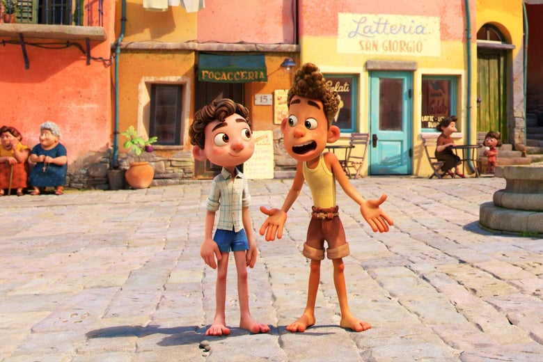 Two boys stand in a piazza. In the background, two women sit on a bench, and an awning advertises a focacceria.