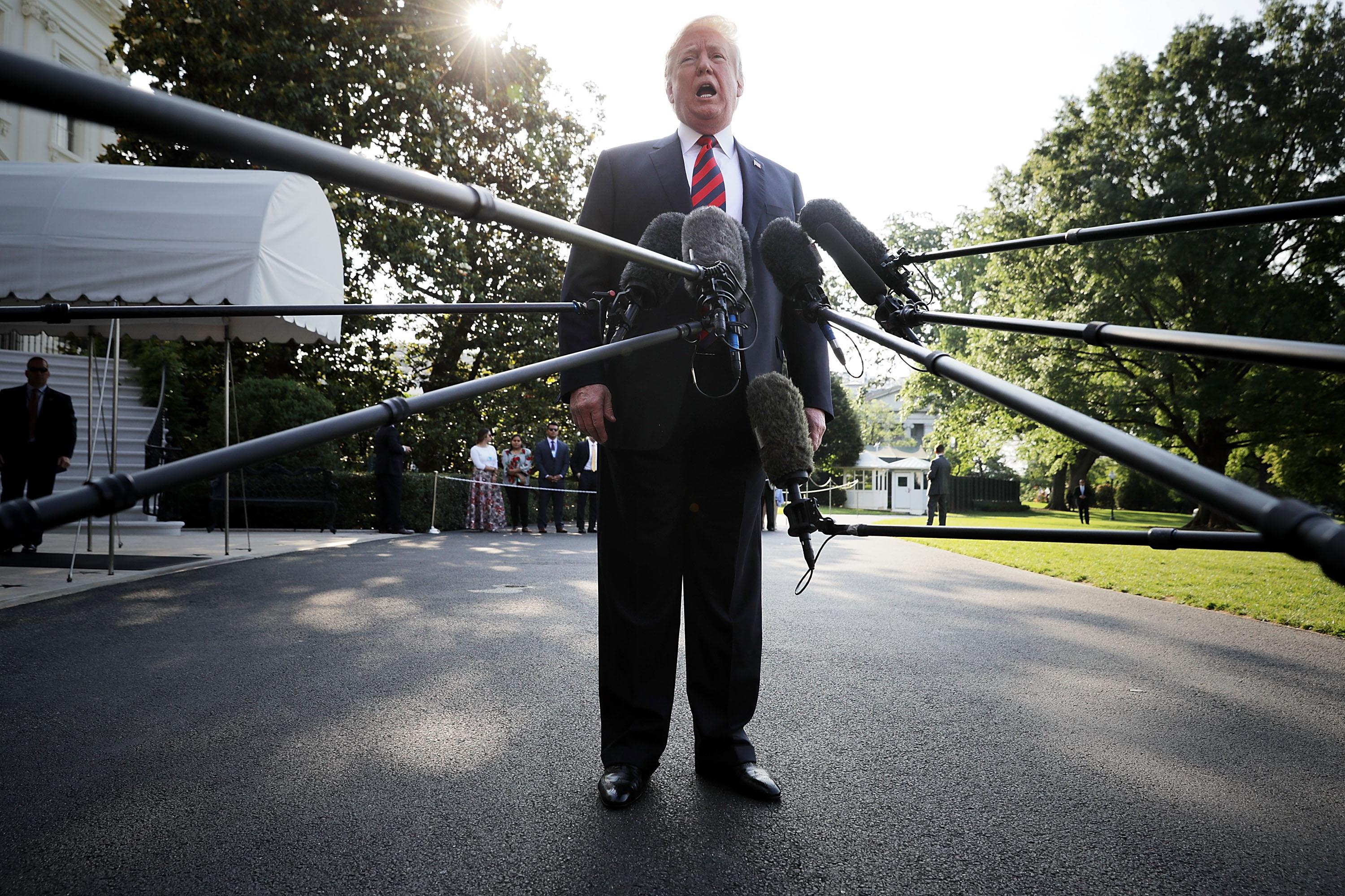 WASHINGTON, DC - JUNE 08:  U.S. President Donald Trump talks to reporters as he departs the White House June 8, 2018 in Washington, DC. Trump is traveling to Canada to attend the G7 summit before heading to Singapore on Saturday for a planned U.S.-North Korea summit.  (Photo by Chip Somodevilla/Getty Images)