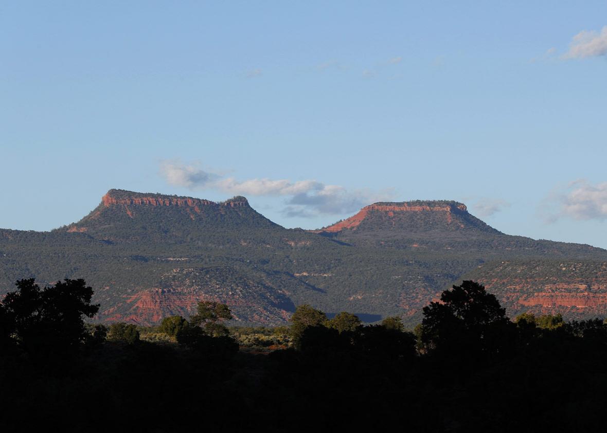 The two bluffs known as the 'Bears Ears' stand off in the distance at sunset in the Bears Ears National Monument on May 11, 2017 outside Blanding, Utah.