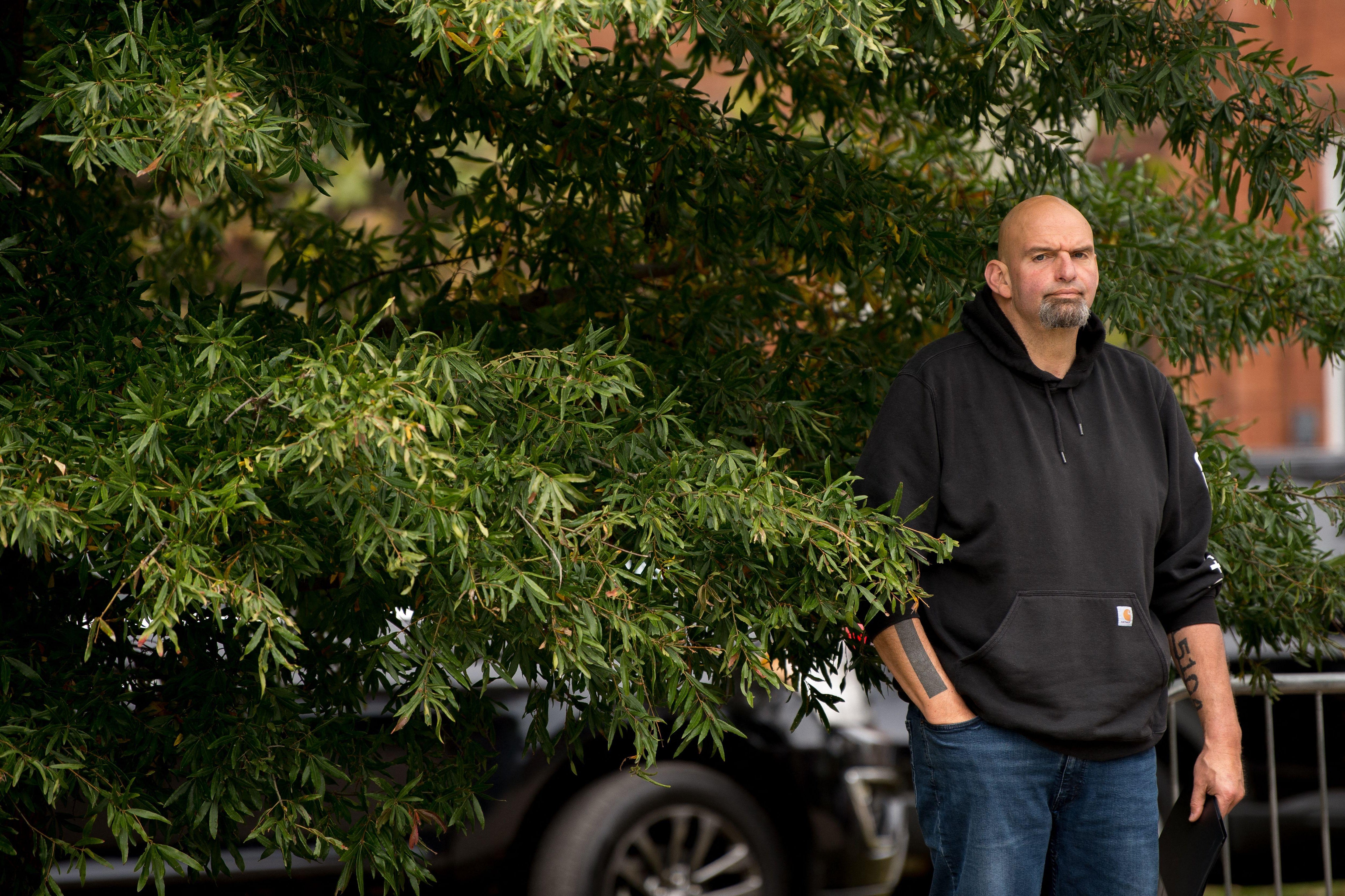 Pennsylvania's Lieutenant Governor John Fetterman waits to speak to supporters gathered in Dickinson Square Park in Philadelphia on October 23, 2022, as he campaigns for the US Senate. - The US midterm election is scheduled for November 8, 2022. (Photo by Kriston Jae Bethel / AFP) (Photo by KRISTON JAE BETHEL/AFP via Getty Images)