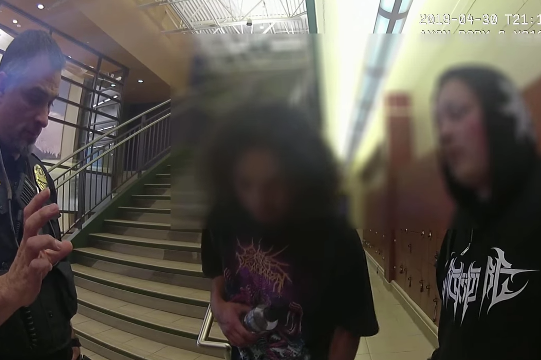 Bodycam footage of the two teenagers, with their faces blurred.