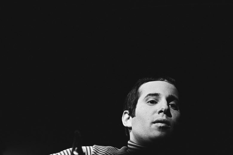 Paul Simon of Simon and Garfunkel performs on stage at the Monterey Pop Festival on June 16 1967 in Monterey, California.