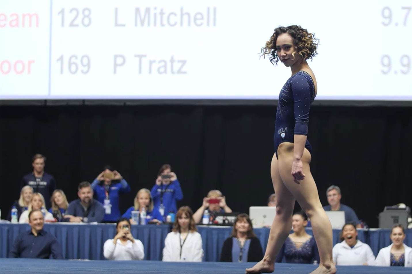 Katelyn Ohashi throws a sassy expression directly at the camera at the end of her floor exercise routine.