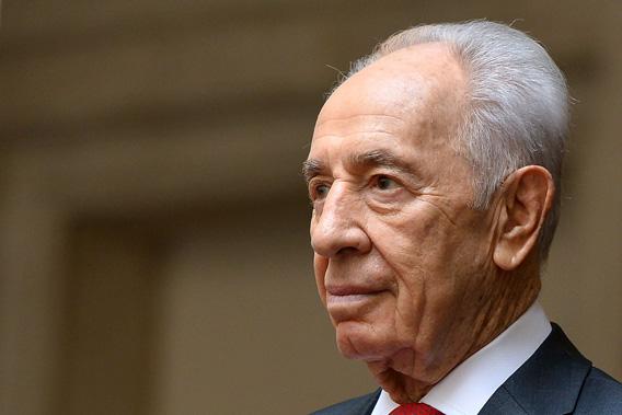 Israeli President Shimon Peres is pictured as he is welcomed by Italian Prime Minister at Chigi Palace in Rome on April 30, 2013.